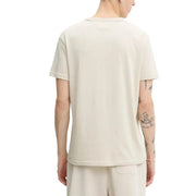 Tommy Hilfiger Jeans hommes t-shirt T-shirt en coton couleur crème à manches courtes, col rond et détails discrets sur les coutures latérales.