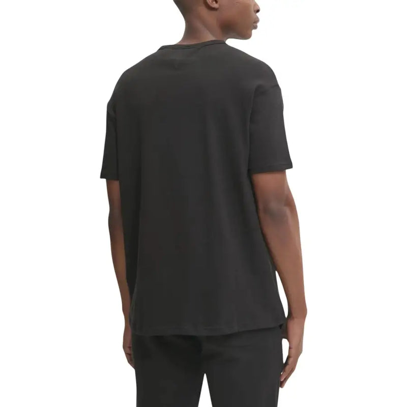 Coton noir Tommy Hilfiger Jeans hommes t-shirt avec un col rond et des manches courtes pour une tenue décontractée