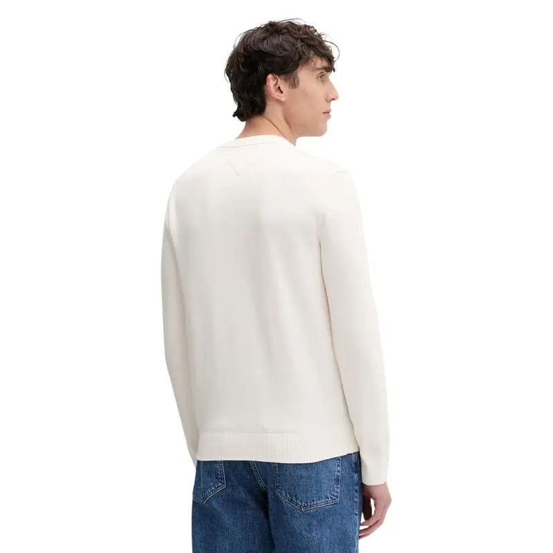 Tommy Hilfiger Jeans Pull en maille crème pour homme, avec col rond et poignets côtelés, en coton biologique