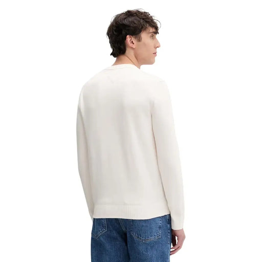Tommy Hilfiger Jeans Pull en maille crème pour homme, avec col rond et poignets côtelés, en coton biologique