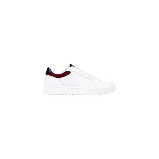 White leather low-top sneaker with burgundy accents and black laces.