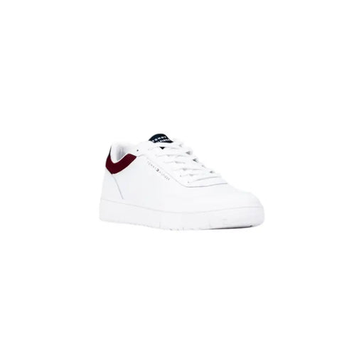 White leather low-top sneaker with burgundy accents and nike swoosh logo.
