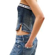 jean Tommy Girl court en denim bleu top avec des détails en forme d'étoile et un ourlet brut, confectionné en coton biologique par Tommy Hilfiger Jeans femmes