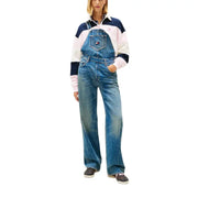 Blue denim overalls with a classic design and tommy hilfiger logo patch on the chest pocket for women