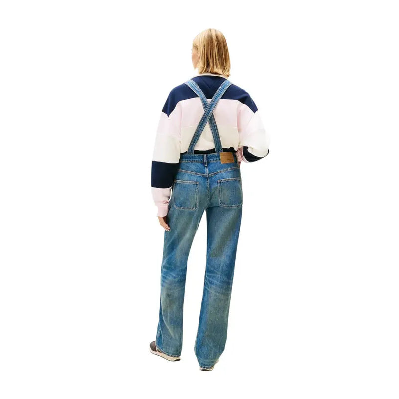 Blue denim overalls with crossed shoulder straps and brown leather belt loop in tommy hilfiger light blue jumpsuit for women