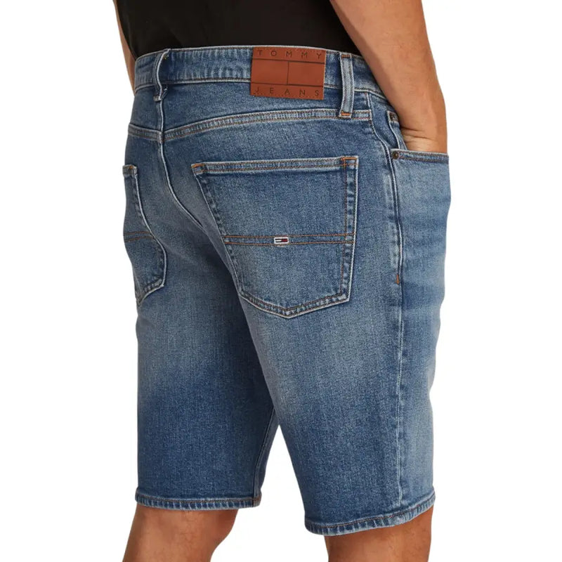 Blue denim shorts with brown leather patch and tommy jeans logo on back pocket made of organic cotton by tommy hilfiger