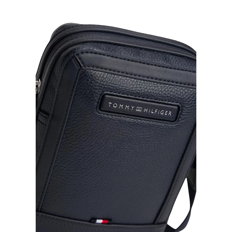 Tommy Hilfiger Sacoche homme bleue centrale mini reporter en cuir noir texturé avec détails cousus
