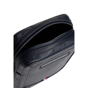 Tommy Hilfiger Sacoche homme bleue Central Mini Reporter en cuir texturé noir avec fermeture éclair argentée et plaque logo de la marque