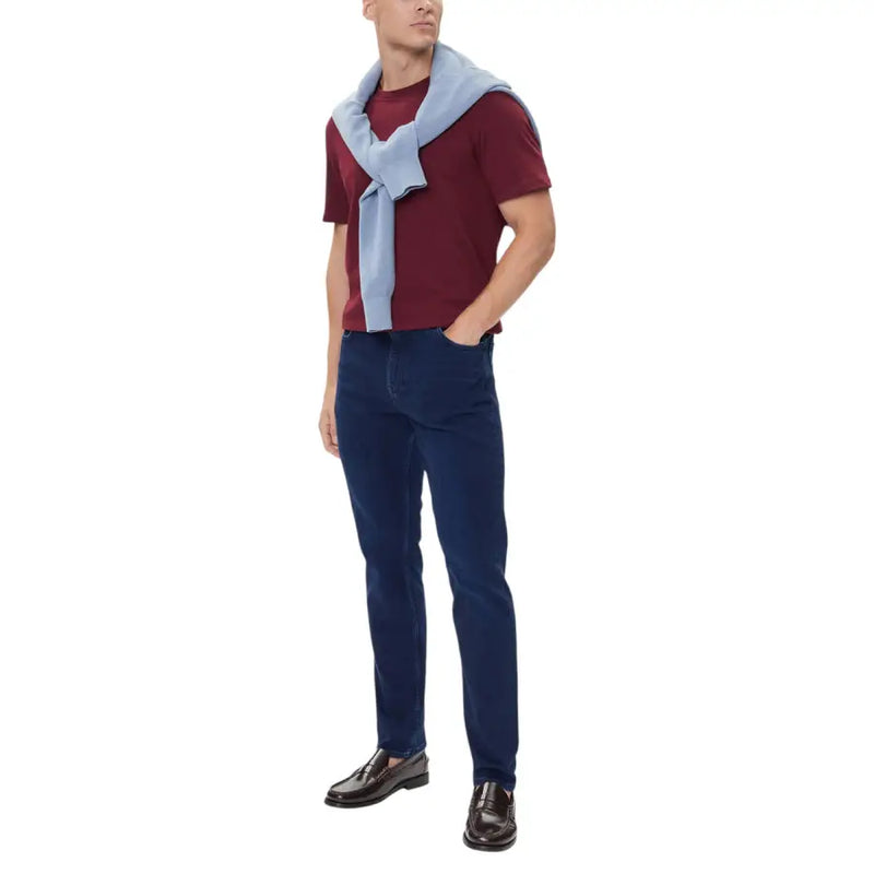Tommy Hilfiger Jean slim bleu en coton biologique pour homme, avec un tissu à la texture lisse et une coupe classique à cinq poches.