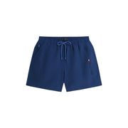 Short de bain Tommy Hilfiger pour homme, bleu marine, en polyester à la texture subtile et à la taille élastiquée avec cordon de serrage assorti.