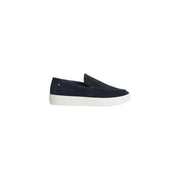 Tommy Hilfiger Mocassin pour homme en daim bleu marine, semelle en caoutchouc blanc.
