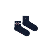 Navy blue Tommy Hilfiger ankle socks with white and red embroidered H logo cuff paired with white cotton blend boxer briefs