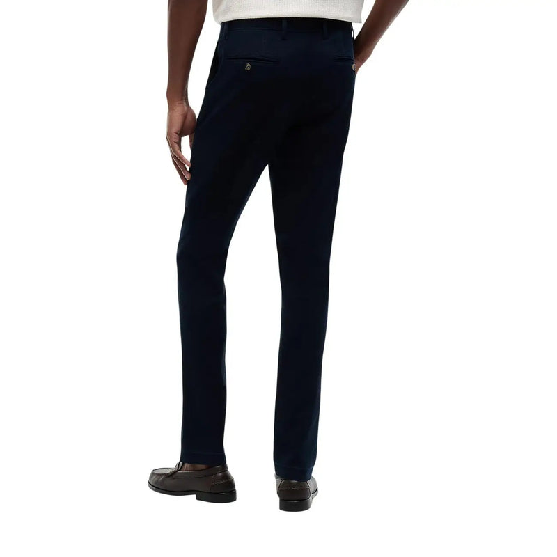 Pantalon Tommy Hilfiger pour homme en coton bleu marine foncé, coupe Denton, avec logo brodé et texture tissée.