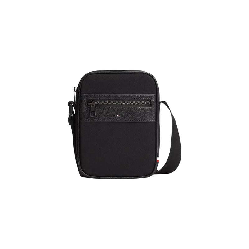 Sac reporter mini Tommy Hilfiger pour homme en similicuir noir, avec panneau avant texturé et fermeture éclair, largeur 15 cm.