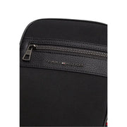 Tommy Hilfiger Sac bandoulière mini reporter pour homme en similicuir noir avec finitions en cuir texturé et fermeture éclair.