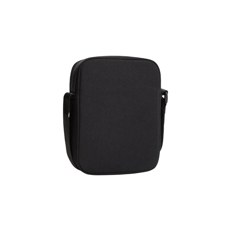 Tommy Hilfiger Sacoche de reporter mini pour homme en similicuir noir, corps en tissu texturé et fermeture éclair assortie, largeur 15 cm.