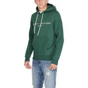 Tommy Hilfiger Sweat à capuche vert en coton pour homme, avec cordons de serrage blancs et poche avant.