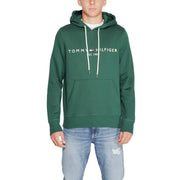 Tommy Hilfiger Sweat à capuche vert foncé en coton pour homme, avec cordons de serrage blancs et poche avant.