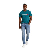 Tommy Hilfiger T-shirt homme en coton bio vert, avec logo blanc et rouge sur la poitrine, de couleur turquoise.