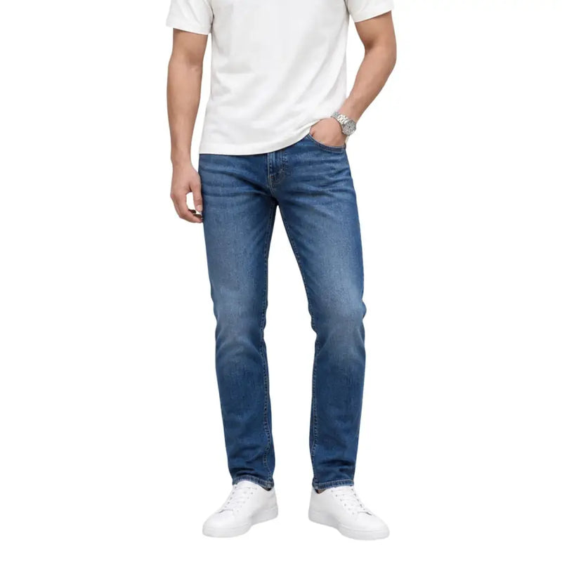 Jean slim en coton denim bleu avec un délavage subtil. Tommy Hilfiger Collection Austin slim fuselée pour hommes