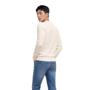 Pull en maille côtelée couleur crème, confectionné en coton biologique, avec un col rond. Tommy Hilfiger tricots pour hommes