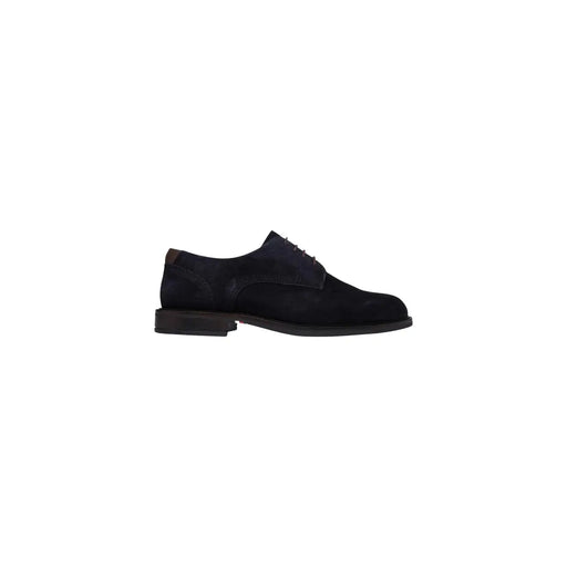 Chaussures derby en daim noir avec laçage classique et empiècements en cuir marron foncé, signées Tommy Hilfiger. Mocassins en cuir blanc pour homme.