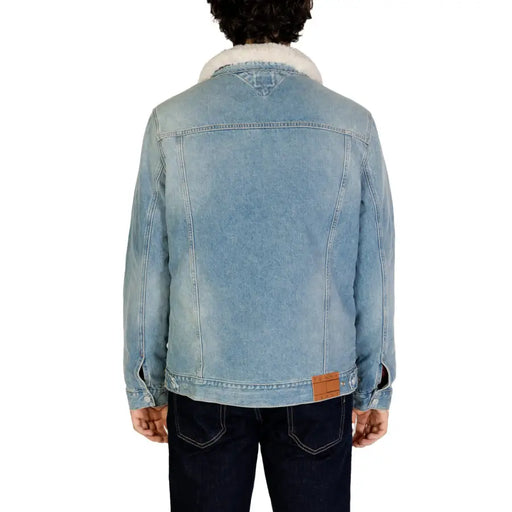 Men’s light wash denim jacket with sherpa collar and brand patch from Tommy Hilfiger