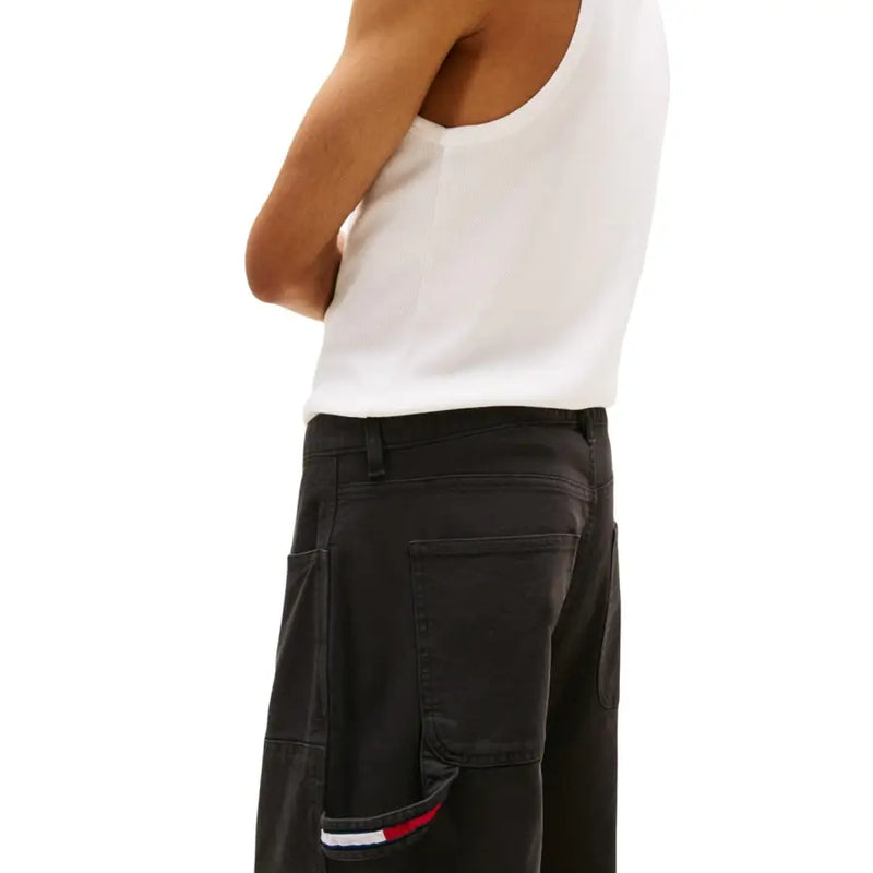 Tommy hilfiger men organic cotton stretch black cargo pants with a red white and blue striped logo on the lower leg