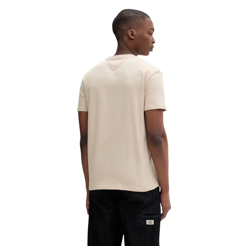Tommy Hilfiger T-shirt homme beige en coton bio, manches courtes, col rond et détails de couture discrets.