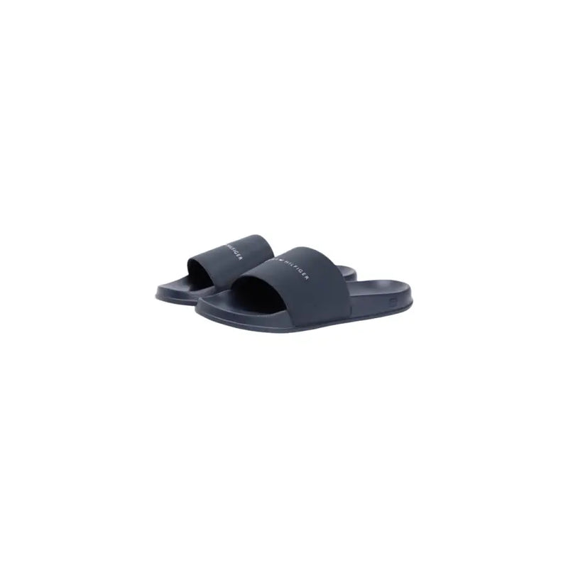 Sandales mules Tommy Hilfiger pour homme, bleu marine foncé, au design minimaliste et au logo blanc discret, en polyuréthane.