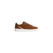 Tommy Hilfiger baskets basses en daim beige pour hommetop avec une semelle en caoutchouc blanc et une subtile bande beige pour l'automne-hiver
