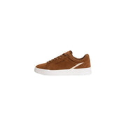 Tommy Hilfiger baskets basses en daim beige pour hommetop avec une semelle en caoutchouc blanc et une bande diagonale crème pour une utilisation automne-hiver