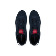 Dark navy Tommy Hilfiger men sneakers in polyester with red branding accents and white rubber soles