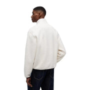 Veste polaire couleur crème à col montant et manches longues, faisant partie de la collection de sweats à capuche blancs en polyester Tommy Hilfiger pour homme.