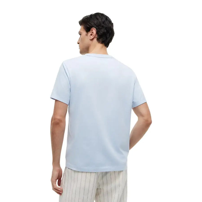 Tommy Hilfiger T-shirt homme bleu clair à manches courtes et col rond, en coton biologique, coupe classique.