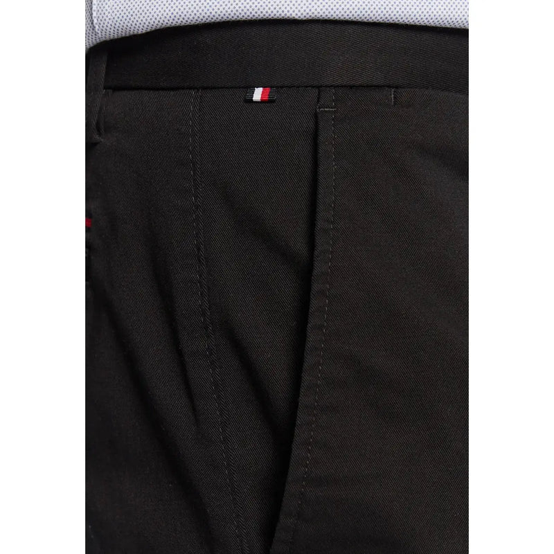 Black Tommy Hilfiger men trousers with subtle woven texture and red white and blue striped waistband tag