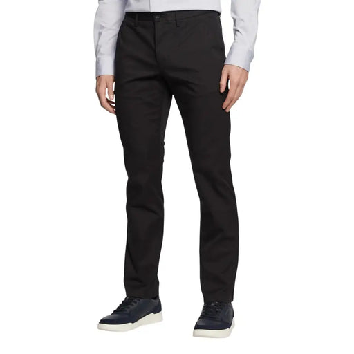 Tailleur noir Tommy Hilfiger Pantalon pour homme à la coupe droite élégante et aux plis subtils, confectionné dans un tissu haut de gamme.