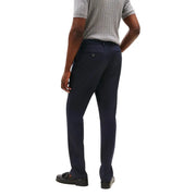 Tommy Hilfiger men trousers in dark navy blue with a sleek slim-fit cut and subtle textured fabric