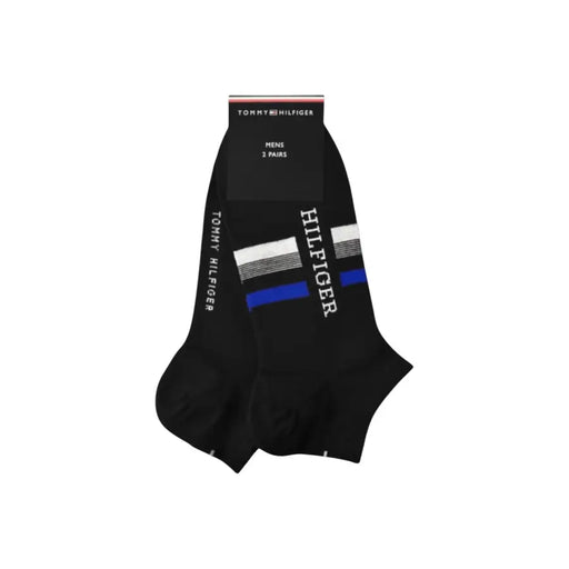 Chaussettes Tommy Hilfiger noires pour homme, à rayures blanches et bleues et logo de la marque imprimé verticalement, pour un style décontracté.