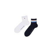 Une paire de Tommy Hilfiger Chaussettes pour homme, blanches et marine, avec une bande rayée griffée.