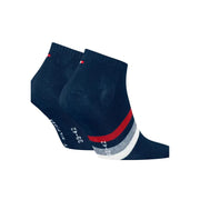 Chaussettes Tommy Hilfiger pour homme, bleu foncé, avec bande rayée rouge et blanche et logo au talon (vue de côté).