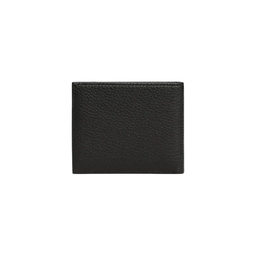 Tommy Hilfiger Portefeuille pour homme en cuir noir texturé, témoignant d'un savoir-faire haut de gamme et d'un design élégant.