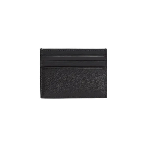 Tommy Hilfiger Portefeuille homme en cuir noir avec porte-cartes, surface texturée et bords cousus.