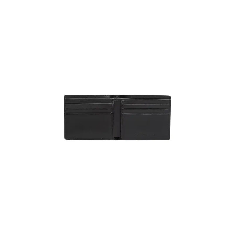 Portefeuille en cuir noir avec plusieurs emplacements pour cartes et design minimaliste de Tommy Hilfiger collection de portefeuilles pour hommes