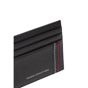 cuir noir Tommy Hilfiger Portefeuille homme avec porte-cartes, surface texturée et surpiqûres rouges, blanches et bleues emblématiques.