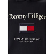 Sweat à capuche noir Tommy Hilfiger en coton, avec lettrage blanc brodé et écusson drapeau rouge, blanc et marine.