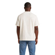 T-shirt en coton couleur crème à manches courtes et col rond classique de Tommy Hilfiger collection homme en coton blanc bio