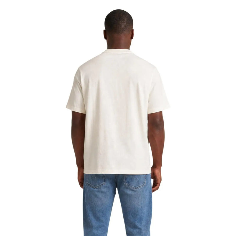 T-shirt en coton couleur crème à manches courtes et col rond classique de Tommy Hilfiger collection homme en coton blanc bio