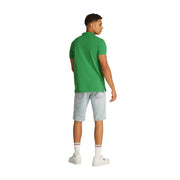 Tommy Hilfiger Polo d'été vert à manches courtes pour homme, avec col classique et coutures soignées.