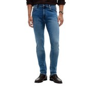 Tommy Hilfiger Jean slim Bleecker pour homme en denim bleu avec un design classique à cinq poches et un délavage subtil sur le devant